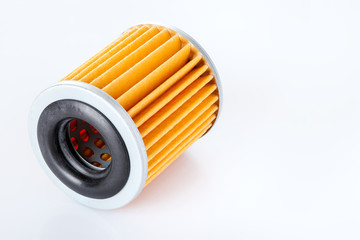 car paper filter assy-oil  on a white background casts a shadow with empty copy space for text, close-up of the car spare part.