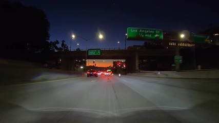 Driving past cones before dawn on the 101 freeway in downtown Los Angeles, California.