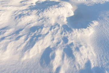 Snowdrift, wind sculpted patterns on snow surface