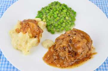 Overhead Image of Salisbury Steak with English Peas and Mashed Potatoes