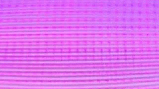Close up of pixels and pixelation distorting and pixelating; abstract colors and grid patterns.
