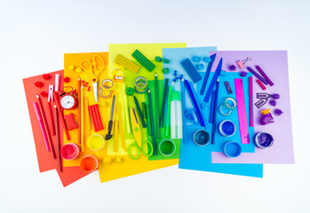 School accessories are laid out in the form of a rainbow. Copy space. white background.