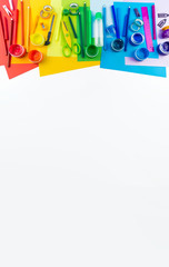 School accessories are laid out in the form of a rainbow. Copy space. white background. banner