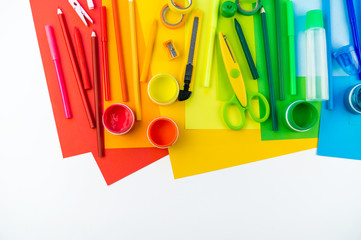 School accessories are laid out in the form of a rainbow. Copy space. white background.