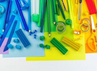 School accessories are laid out in the form of a rainbow. white background.