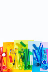 School accessories are laid out in the form of a rainbow. Copy space. white background.