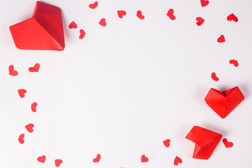 Valentine day concept. Red paper origami hearts.