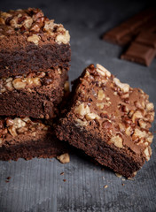 Delicious brownies with walnuts in a stack