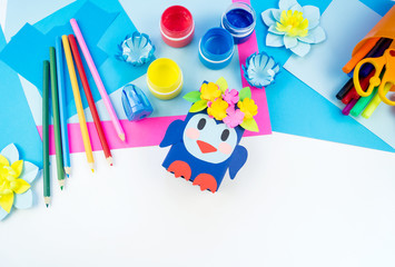 Children's creativity. Materials for crafts from paper. Penguin box