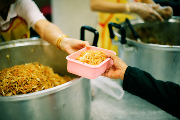 Hand begging for food from the rich's share : the concept of hope
