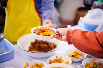 The beggar is waiting for food from charity aid : The concept of sharing help.