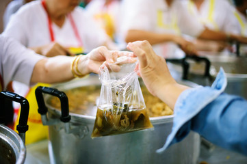 The concept of donating food to the poor To receive food from the hands of those who are wealthy.