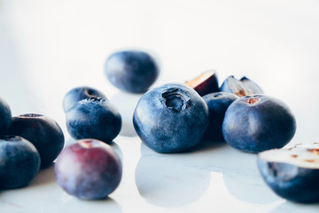 Fresh organic blueberries on a marble background, close up