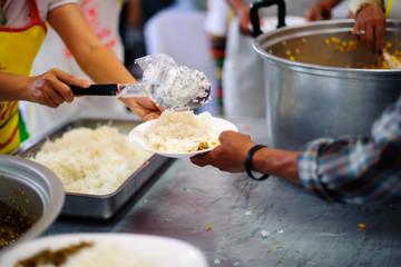 The Hand of the Beggars receives charity food from fellow human beings : the concept of the beggar problem on earth.