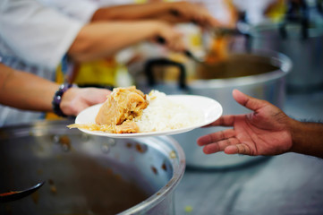 The poor have been sharing food from the kinder society to Relieve Hunger : The Concept of Feeding