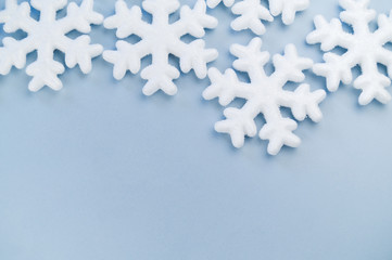 Pattern of decorative snowflakes on a blue background