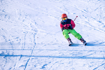 Fototapeta na wymiar People are enjoying kiing / snowboarding