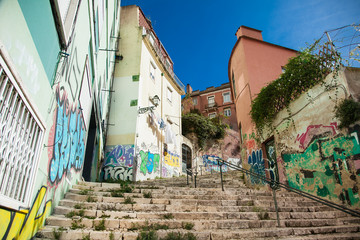 Old stone stairs in Lisbon, detail of stairs in an old street in an old neighborhood in Portugal.