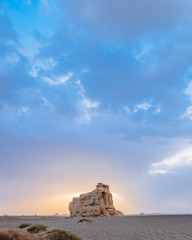 Huge yardang rock in gobi desert against sunset in Dunhuang Yardang National Geopark, Gansu, China