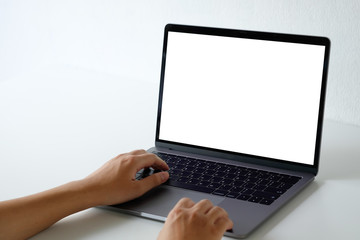 Mockup laptop computer using with a man on office desk.