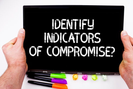 Handwriting text writing Identify Indicators Of Compromise. Concept meaning Detect malware online attacks hacking
