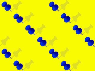 close - up blue pins on yellow background