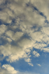 Clouds after rain before sunset as a background