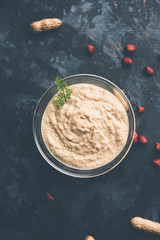 Healthy Peanut chutney made using Groundnut / Shengdana or mungfali. served in a small bowl with raw whole. Selective focus