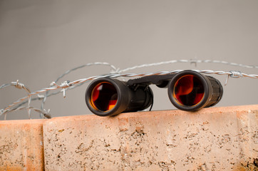 Spy glass atop of a wall