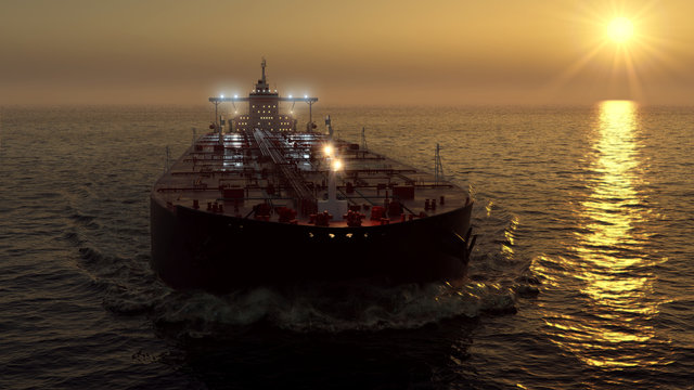 Oil tanker in the ocean on sunset