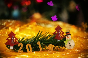 Christmas decoration 2019 on bokeh gold background