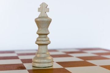 White king on white square on chessboard