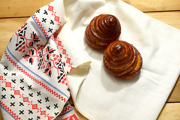 Two buns on a white towel.