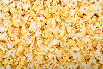 Top view flat lay background of popped popcorn.