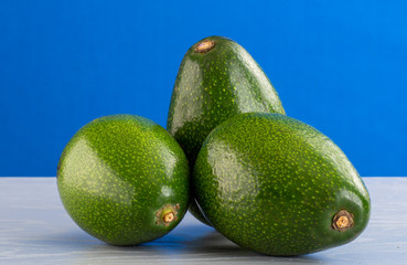 Avocados on a Blue backdrop