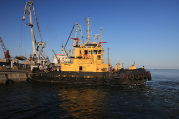 Towing ship on the berth in the seaport