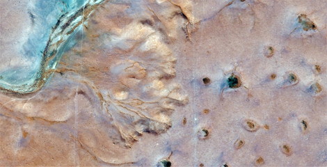stone face, abstract photography of the deserts of Africa from the air. aerial view of desert...