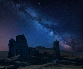 Stunning vibrant Milky Way composite image over abandoned Foggintor Quarry in Dartmoor with raking...