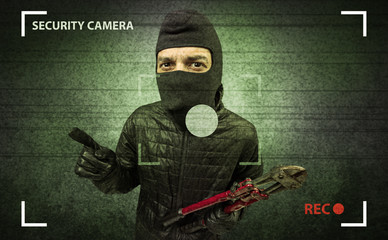 Caught burglar by house camera in action.