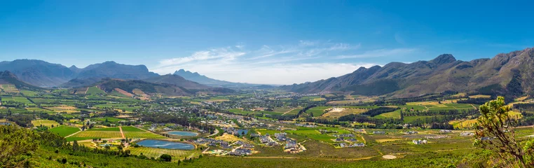 Fotobehang Afrika Franschhoek valley panorama with its famous wineries and surrounding mountains, South Africa  © Dmitrii