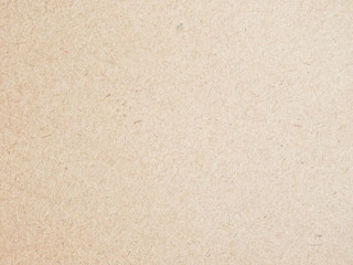 Fototapeta na wymiar Texture of beige cardboard closeup, abstract paper background