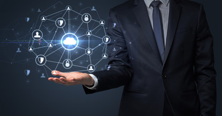 Businessman holding networking connection concept with dark wallpaper