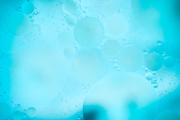 water drops on glass with colorful background, close-up 