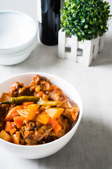 chili pork bones in tomato sauce with carrots and potatoes 