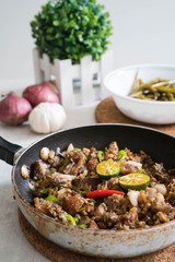 sizzling pork sisig with raw egg