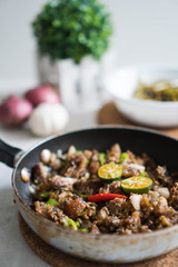 sizzling pork sisig with raw egg