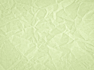 Texture of light green crumpled craft paper. Texture for design, abstract background