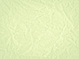 Obraz na płótnie Canvas Texture of light green crumpled craft paper. Texture for design, abstract background