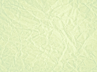 Texture of light green crumpled craft paper. Texture for design, abstract background