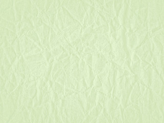 Obraz na płótnie Canvas Texture of light green crumpled craft paper. Texture for design, abstract background